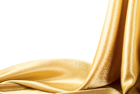 Golden Fabric silk texture for background. Isolated on white. Clipping Pathの写真素材
