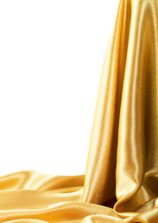 Golden Fabric silk texture for background. Isolated on white. Clipping Pathの写真素材