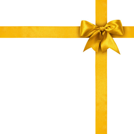 Gold ribbons with bow isolated on white background の写真素材