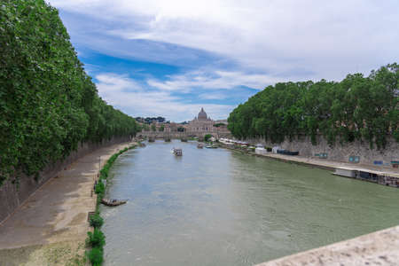 A view of the Tiber River with the Vatican City in the backgrownの写真素材