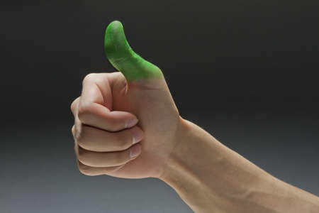 Green thumb, horizontalの写真素材