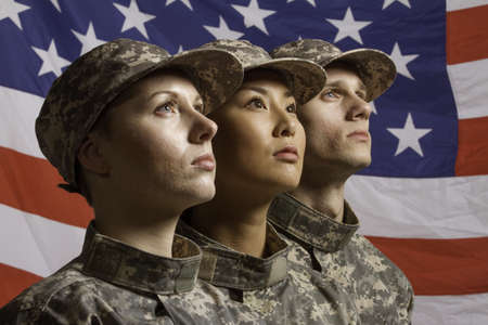 Group of soldiers in front of American flag, horizontal