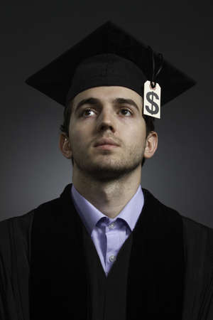 College graduate with tuition debt price tag, verticalの写真素材