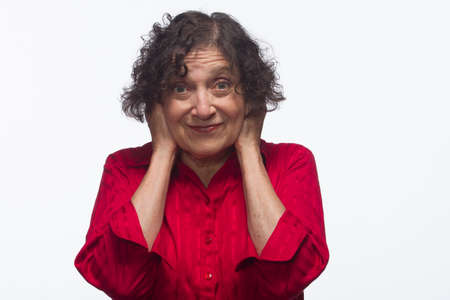 Woman covering ears, horizontalの写真素材