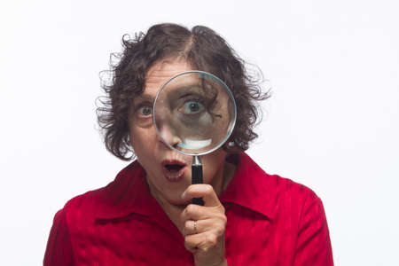 Woman with magnifying glass, horizontalの写真素材