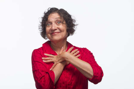 Happy woman crosses arms across chest, horizontalの写真素材
