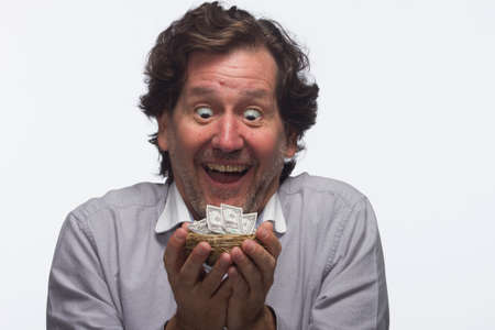 Man with his nest egg, horizontalの写真素材