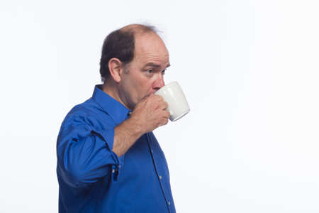 Older man drinking coffee, horizontal