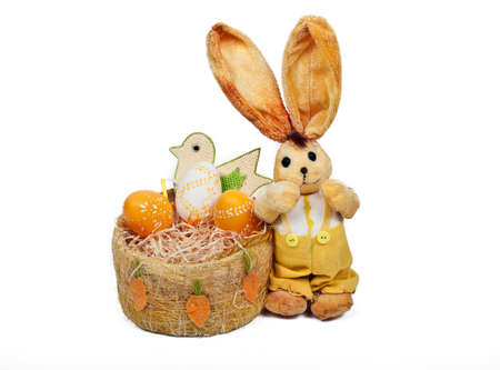 easter rabbit with bird and basket full of eggsの写真素材