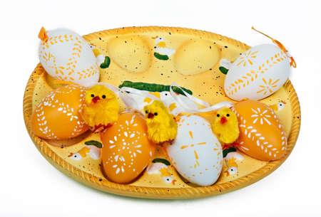 yellow chickens and colorful eggs ready for easterの写真素材
