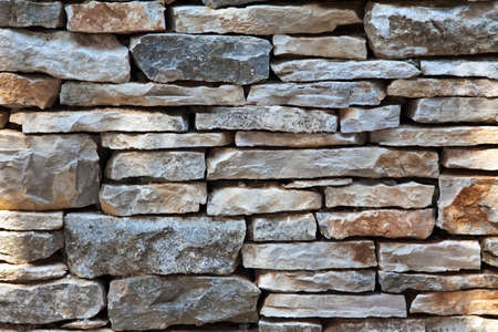 a part of stone wall - details of constructionの写真素材
