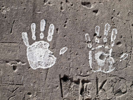 Painted hands on the wallの写真素材