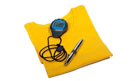 yellow t shirt, digital stop watch and ballpoint pen isolated on white backgroundの写真素材