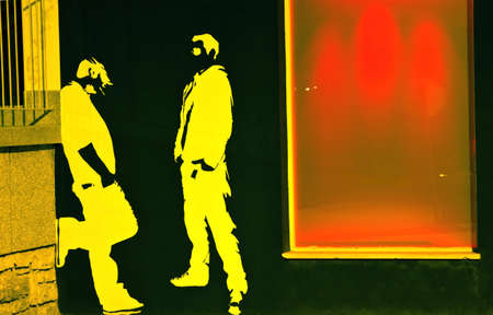 showcase with two guys on black wallの写真素材