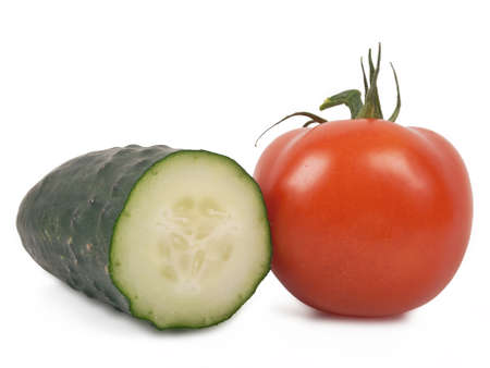 tomato and cucumber isolated on white backgroundの写真素材