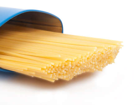 raw yellow spaghetti in blue caseの写真素材