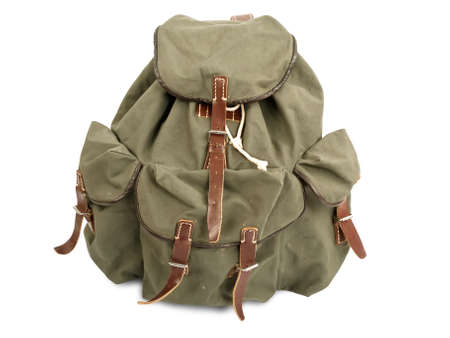 old military backpack isolated on white の写真素材