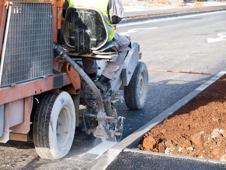 road surface marking works with spray marking machineの写真素材