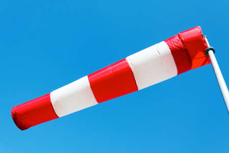 horizontally flying windsock due to high wind.の写真素材