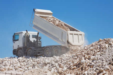 tipper truck unload crushed rocksの写真素材