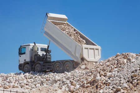 tipper truck unload crushed rocksの写真素材