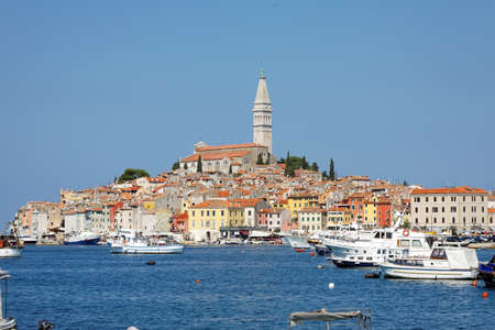 ROVINJ, CROATIA - SEPTEMBER 12 : Boats and ships in the marina with the old town buildings in the background on September 12, 2015 in Rovinj, Croatia. Rovinj is a popular tourist destination on the Adriatic coast.のeditorial素材