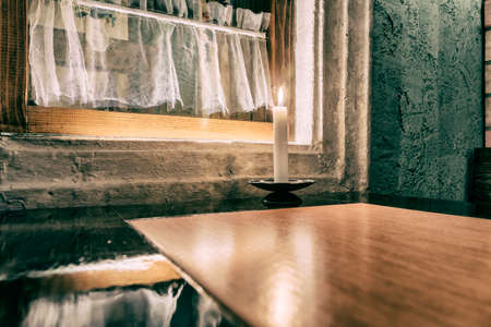 Dark interior design with candle luminationの写真素材