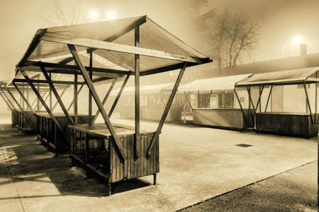 empty open market stall on foggy nightの写真素材