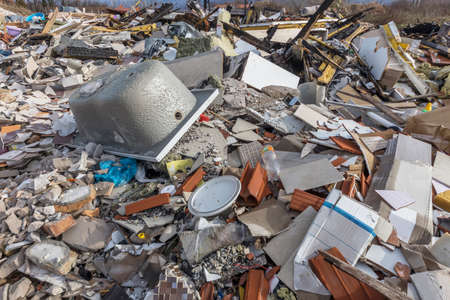 a pile of garbage dumped on an open place