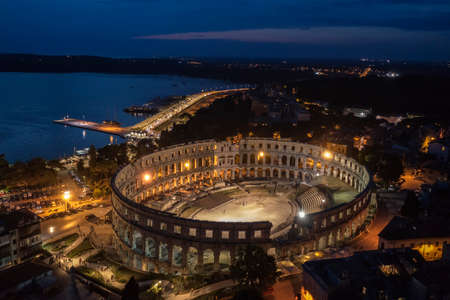 an aerial view of Pula aphitheatre by night, Istria, Croatiaの写真素材