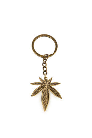 golden colored key ring marijuana, isolated on white background