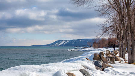 A view of Alpine Ski club and resort ski hills from the Thornbury Marina looking out to Georgian Bay in the winter.のeditorial素材