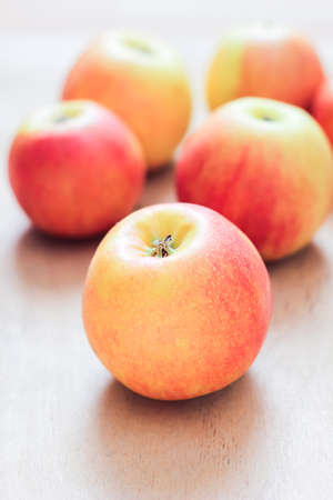 Apples red and yellow close-up on wooden background.の写真素材