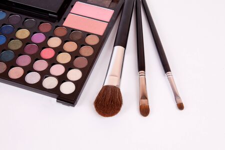Makeup brushes and make-up eye shadows with blushの写真素材