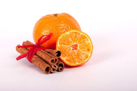 Fresh oranges and cinnamon sticks - Hot drinks ingredientsの写真素材