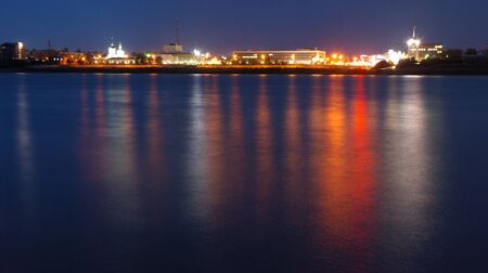 Multi-coloured reflexions from a city in the riverの写真素材