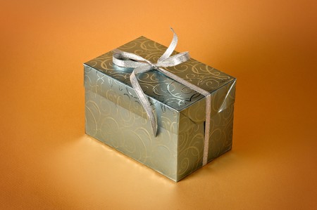 Little gift isolated on orange background