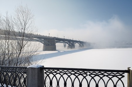 Two bridges through the river vanish in fogの写真素材