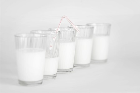 Milk glasses on a white backgroundの写真素材