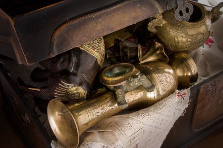 Chest full of old bronze souvenirsの写真素材