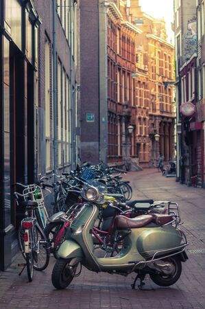 Moped parked on a street in Amsterdamのeditorial素材