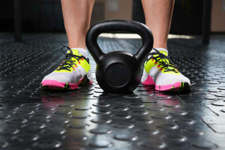 Girl athlete raises the weightの写真素材