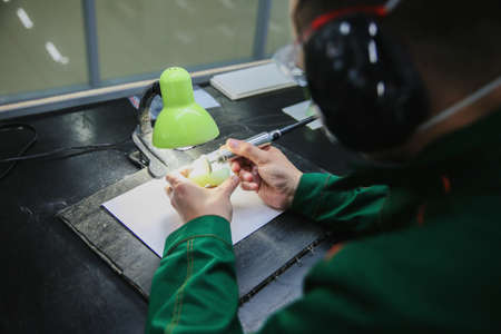 Processing of jade. industrial jewelry manufacturing. Sacred stone of Chinaの写真素材