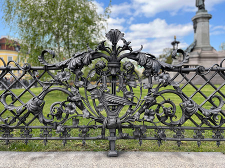 Baroque fragment of wrought iron fence in urban area, Warsaw, Europeの写真素材