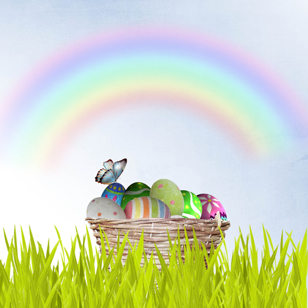  Easter basket with decorated eggs and the Easter bunny in the grassの写真素材