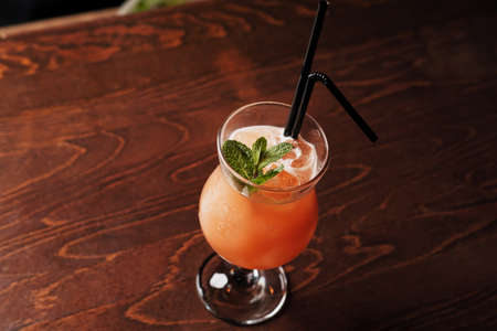 Alcoholic cocktail on the basis of gin, cherry, orange and liqueur Benediktin, grenadine, pineapple and lemon juice with the addition of bitter.の写真素材