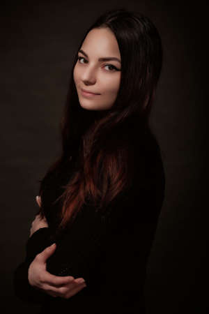Beautiful Russian young female brunette model gray backgroundの写真素材