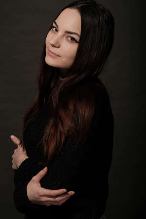 Beautiful Russian young female brunette model gray backgroundの写真素材