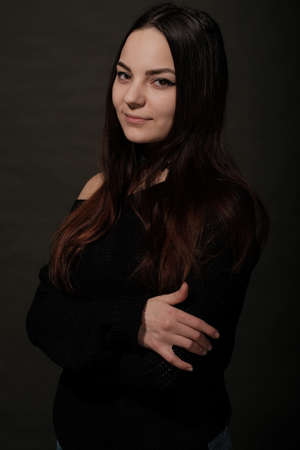 Beautiful Russian young female brunette model gray backgroundの写真素材