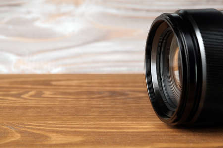 camera photo lens on old wooden tableの写真素材
